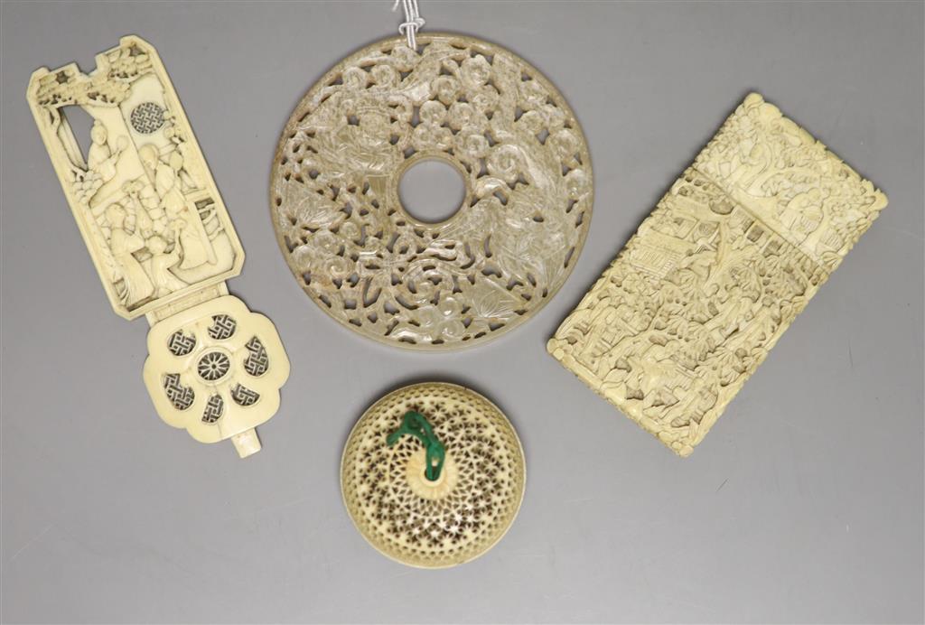 Three pieces of 19th century Chinese export carved ivory to include a card case, a pomander and a decorative panel, together with a car
